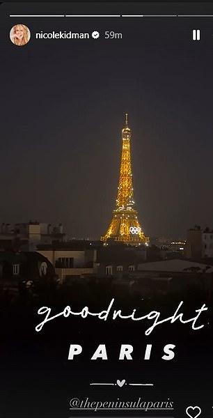 Ночная Эйфелева башня сияла над темными крышами город